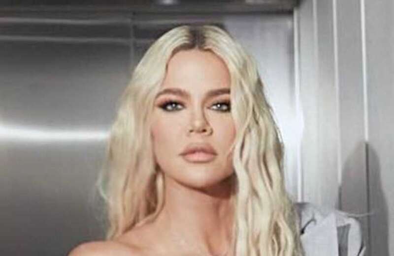 Khloe's tiny frame drowns in baggy Good American sweatpants for sexy photos