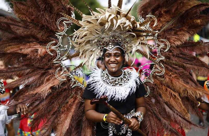 Notting Hill revellers dance in fabulous feather outfits at famous carnival