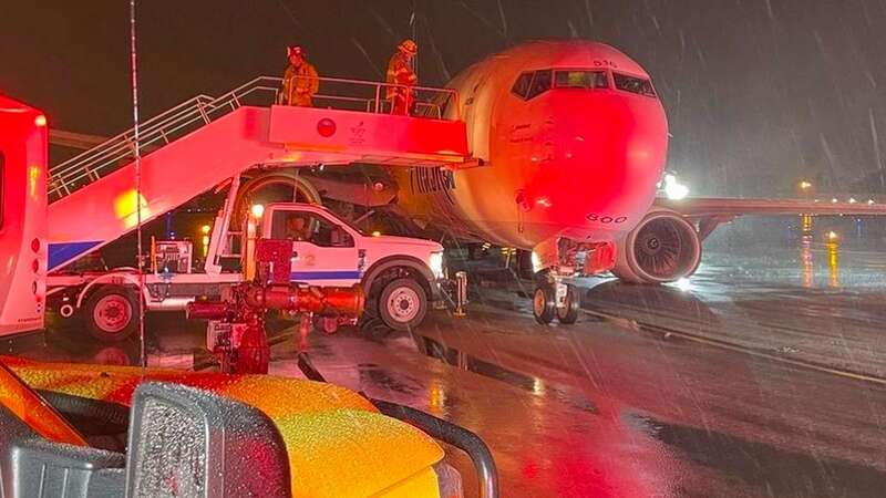 Firefighters with the Orange County Fire Authority help passengers disembark the Alaska Airlines Flight (Image: Orange County Fire Authority)