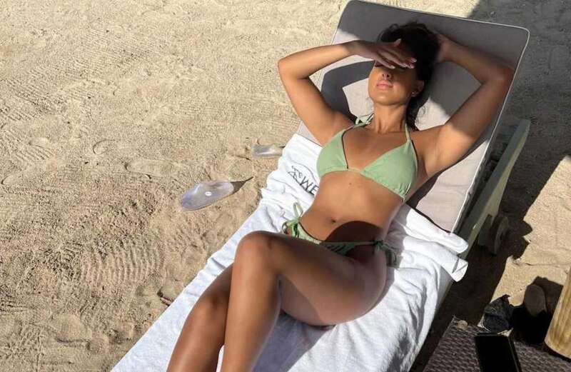 Love Island winner Sanam Harrinanan looks incredible stripping to a green bikini