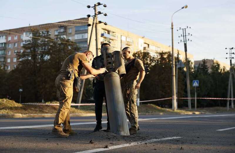 Ukrainian soldiers inspect Russian missile in Kramatorsk after Russian attacks