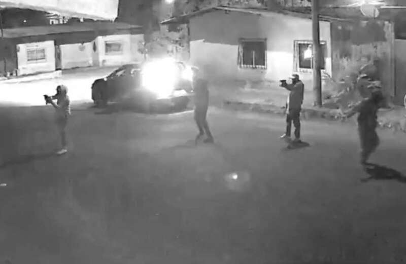 Moment bungling assassins blow themselves up with a grenade in getaway car