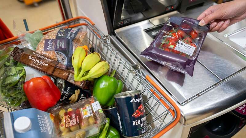 This image shows someone scanning food at a self-service checkout (stock image) (Image: Getty Images)