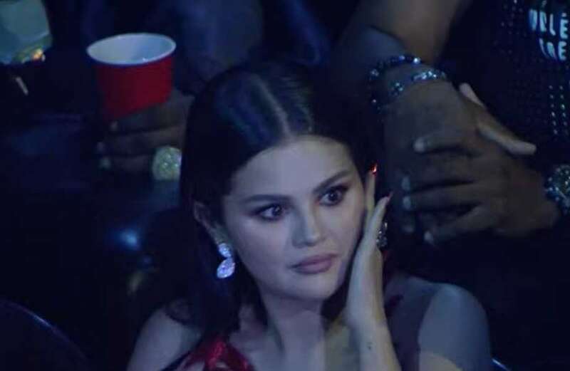 Selena Gomez winces in concern during Olivia Rodrigo's VMAs performance