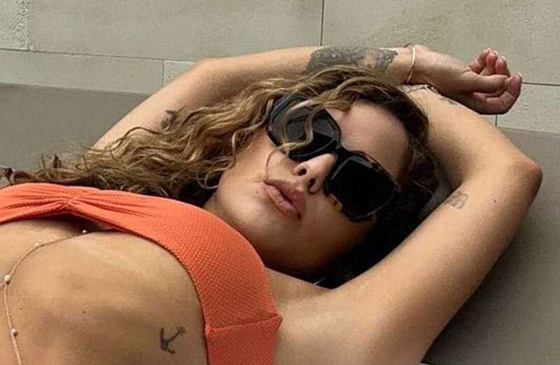 Brittney Palmer shows off curves in barely-there bikini with fans left stunned