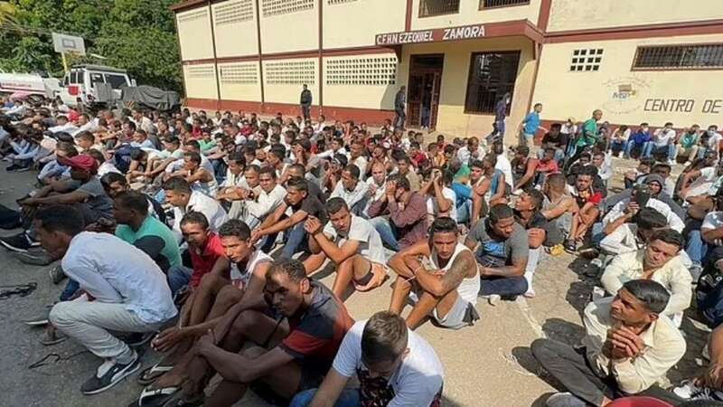 Inmates were lined up outside the jail building before authorities started to transfer them out (Image: NicolasMaduro/Twitter)