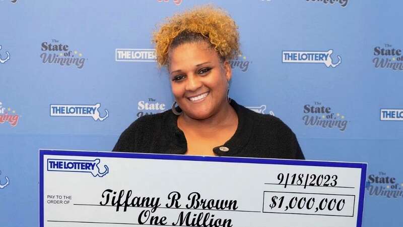 Beaming Tiffany with her $1 million Powerball prize cheque (Image: Massachusetts State Lottery)