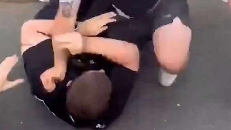 One police officer was knocked to the floor with bystanders trying to pull his assailant off him (Image: Twitter)