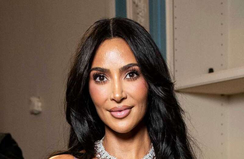 Kim suffers NSFW wardrobe malfunction in a silk slip dress at Paris show