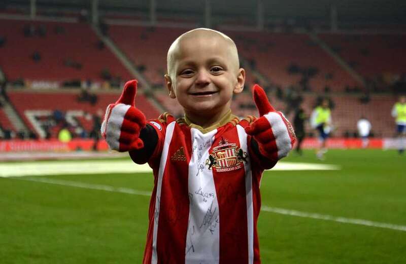 Cops arrest two after football yobs 'taunt' fans with Bradley Lowery pic