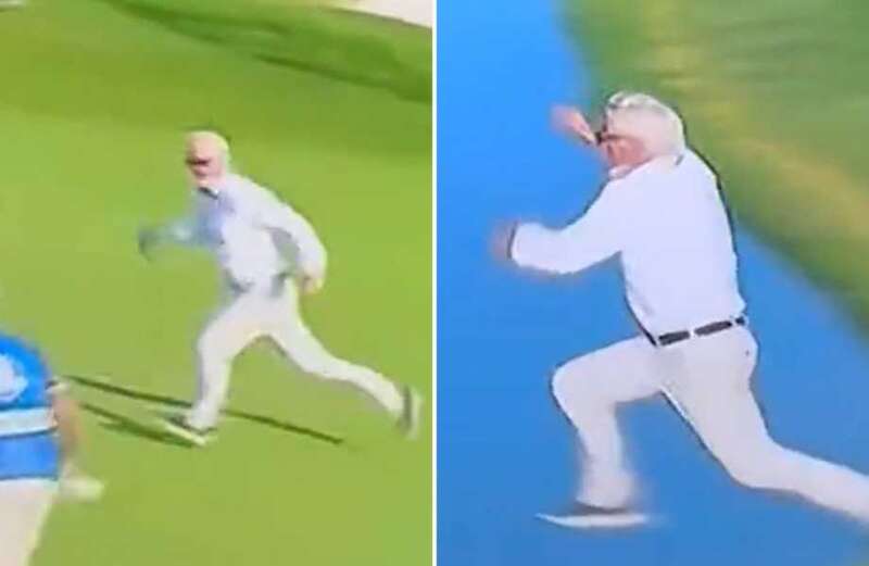 Watch moment fan evades security to sprint across green and into lake