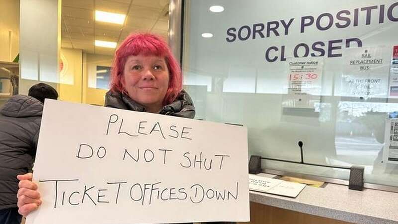 Sarah Leadbetter holding a sign calling for more manned stations (Image: Western Daily Press)