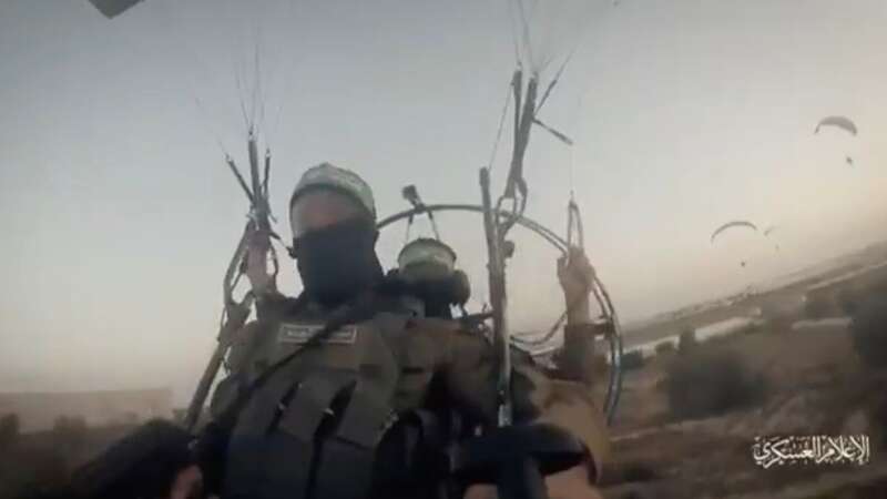 Moment Hamas fighters seen paragliding across Israel border before deadly attack