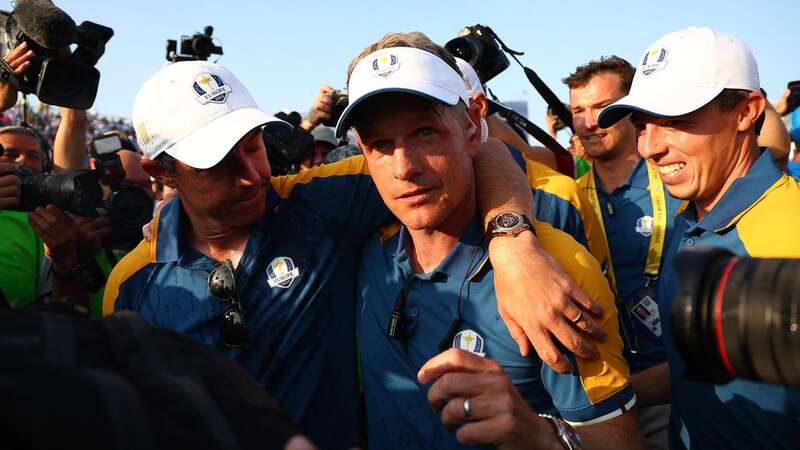 Luke Donald celebrates with Rory McIlroy and Matt Fitzpatrick after Europe