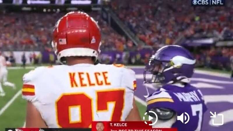 Travis Kelce #87 of the Kansas City Chiefs runs past Byron Murphy Jr. #7 of the Minnesota Vikings while scoring a receiving touchdown