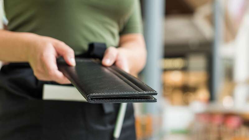 A waitress was given a wonderful surprise by a couple while in the middle of a terrible situation (stock photo) (Image: Getty Images/iStockphoto)