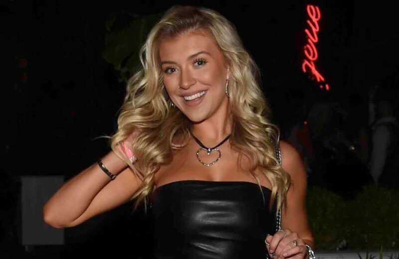 Love Island's Molly Marsh flashes toned legs in tiny leather minidress