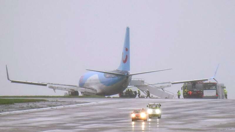 Emergency services next to a passenger plane which came off the runway at Leeds Bradford Airport while landing in windy conditions during Storm Babet (Image: PA)