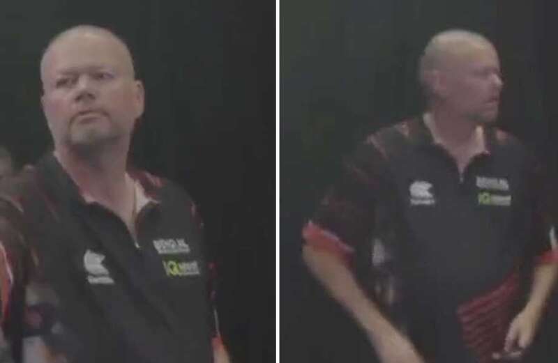 Van Barneveld looks baffled as Anderson accidentally interrupts his darts match