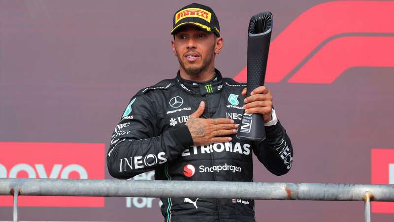 Lewis Hamilton collected his trophy on the US GP podium but was later stripped of it (Image: Hasan Bratic/picture-alliance/dpa/AP Images)