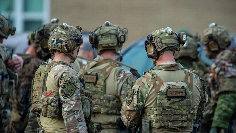 Law enforcement officers gather outside Lewiston High School (Image: AFP via Getty Images)