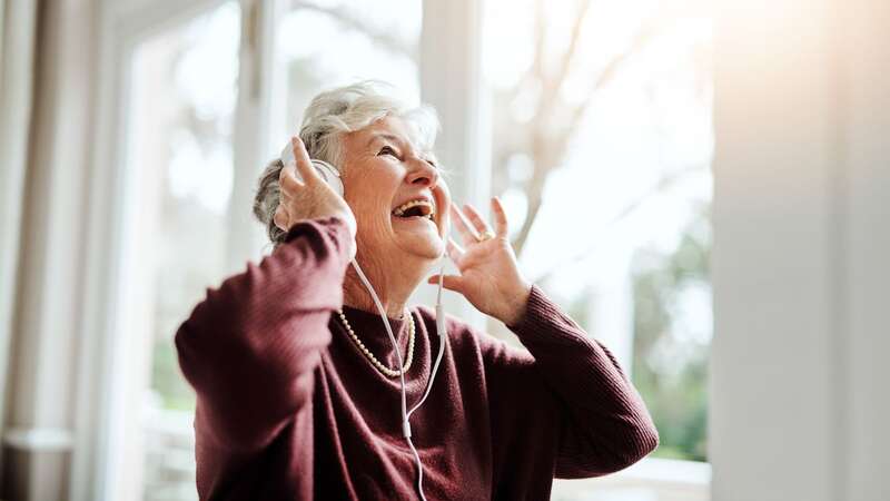 A study has found that listening to your favourite tunes can reduce pain (Image: Getty Images)