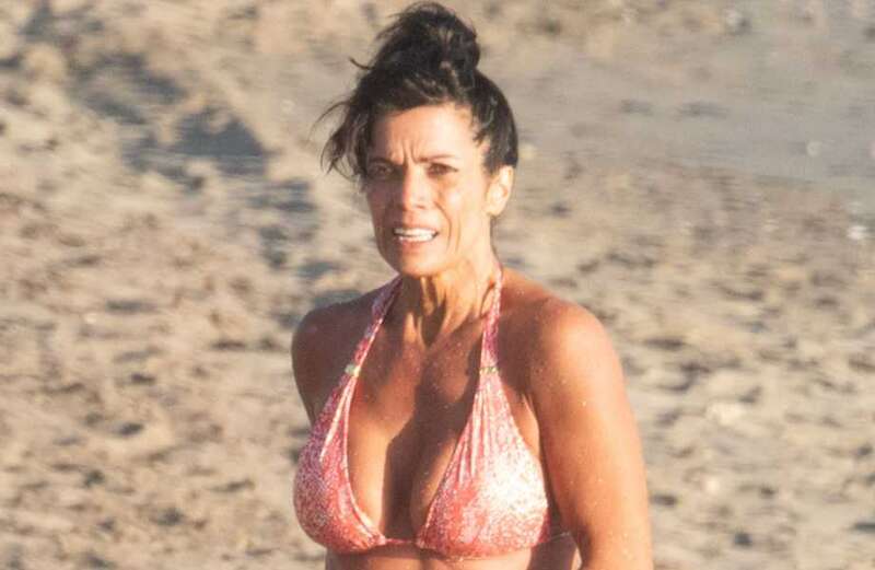 Jenny Powell, 55, flaunts age-defying figure as strips to bikini in Marbella