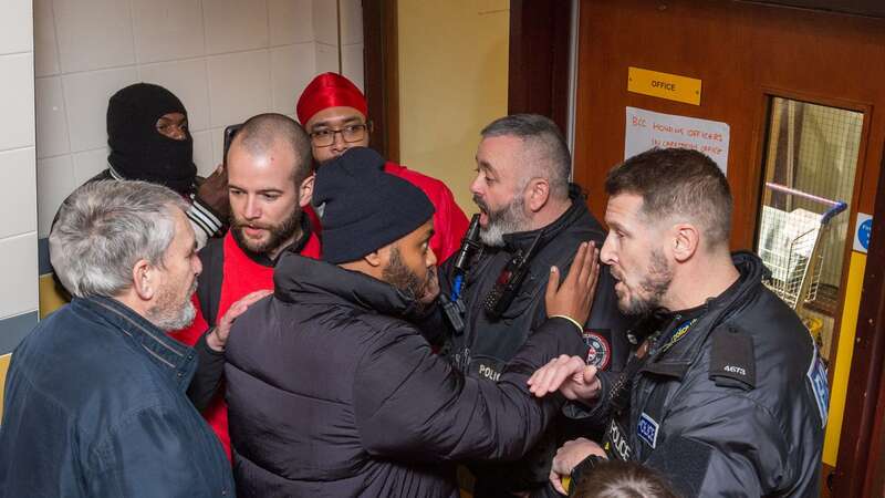 Angered residents of Barton House in Bristol are seen banging on the doors of the council office after rumours circulated about their belongings being removed without their permission (Image: Simon Chapman/LNP)