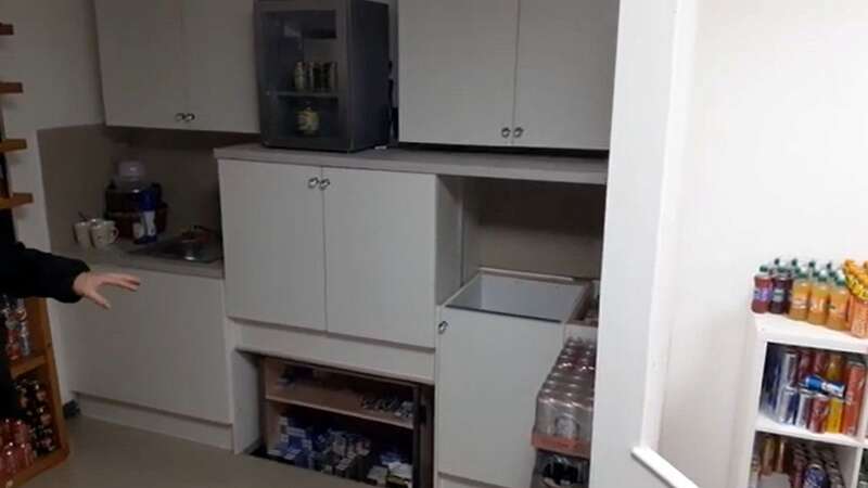 The secret compartment that rises up under a cabinet is pictured (Image: DerbyCityCouncilTradingStd /SWNS)