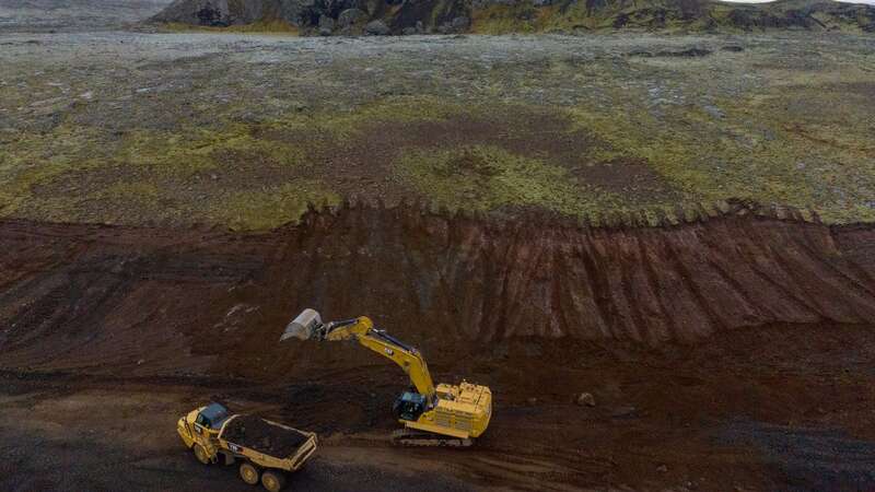 Officials hope trenches will draw deadly lava away from the town (Image: Andy Commins / Daily Mirror)