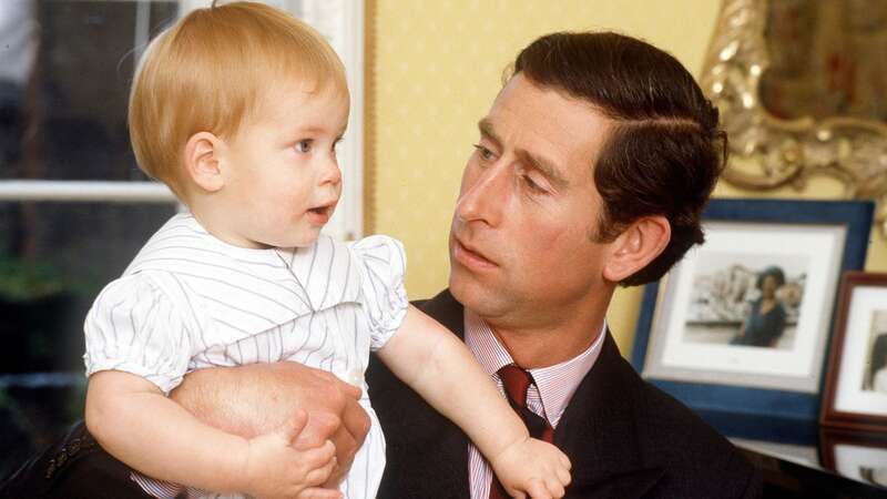 Prince Charles with Prince Harry, aged one, at home in Kensington Palace (Image: Tim Graham Photo Library via Getty Images)