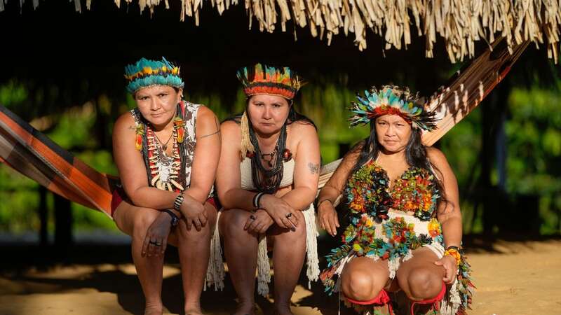 Mandei Juma (right) is leading the tribe to safety (Image: AP)