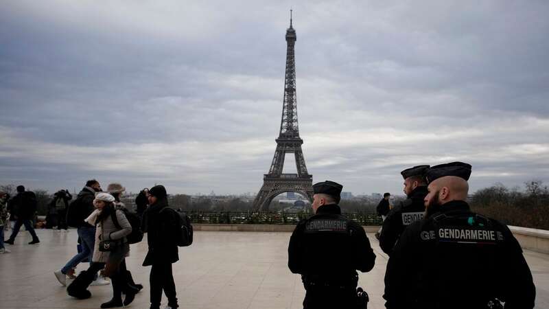 French gendarmes patrol the Trocadero plaza near the Eiffel Tower (Image: AP)