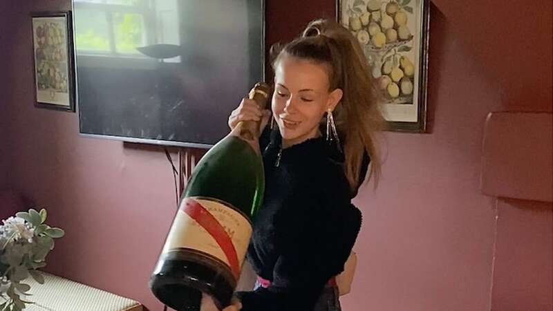 Inside abandoned hotel that still has full bar with enormous champagne bottles