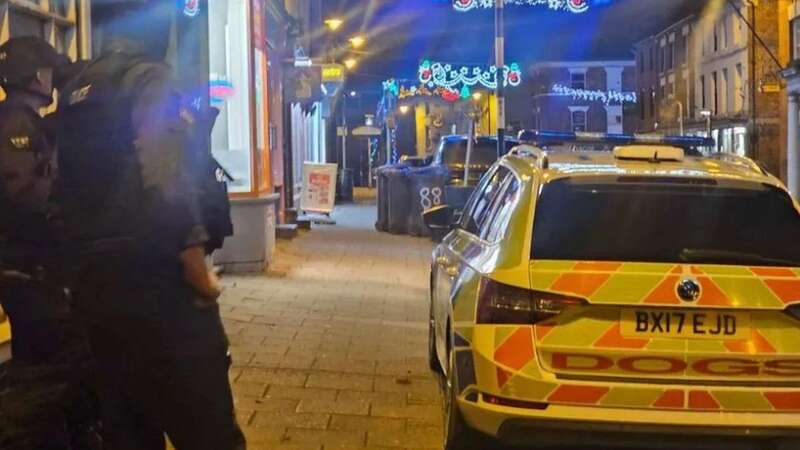 Armed police on the High Street in Cheadle