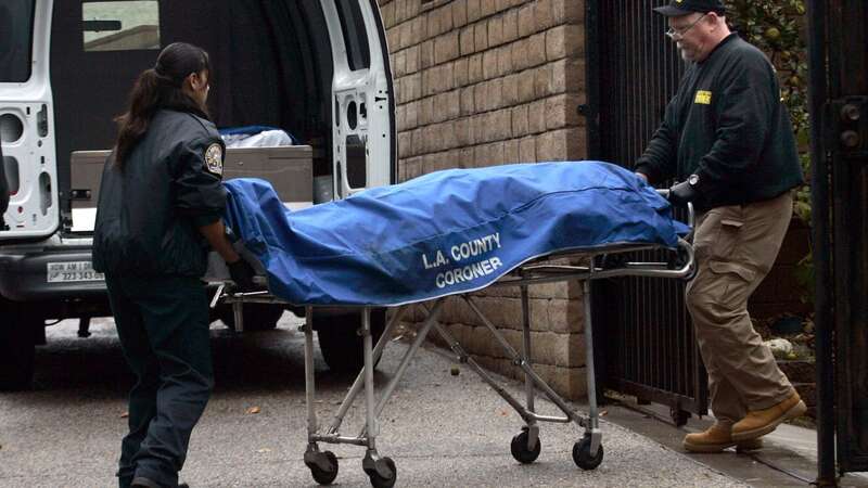 Coroners work on Christmas day to remove the body of Bruce Jeffrey Prado, the man behind the Covina massacre (Image: Los Angeles Times via Getty Images)