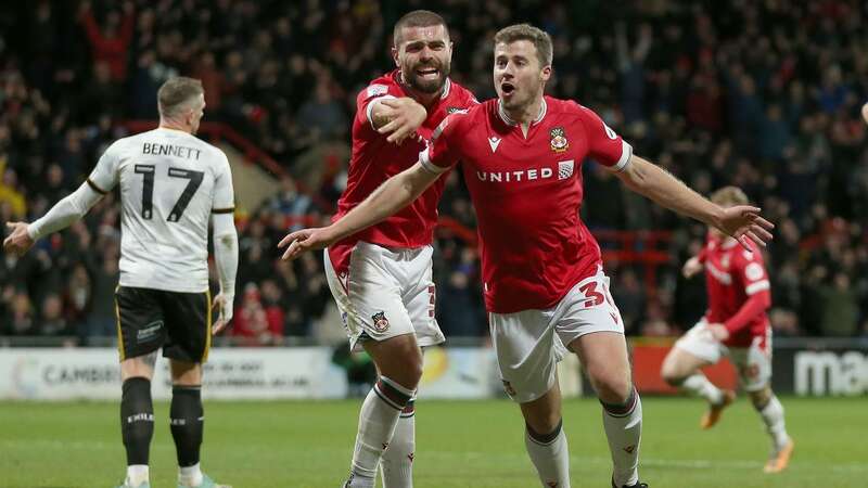 Wrexham’s James Jones (right) celebrates scoring in front of the Kop end (Image: PA)