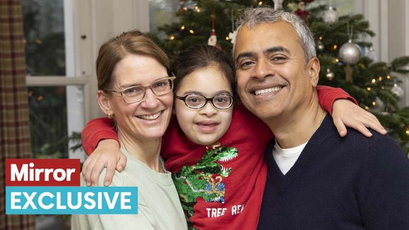 Elsie with parents Helen and Arun getting ready for Christmas (Image: TIM ANDERSON)