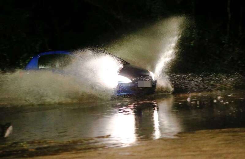 Partially submerged cars have been seen across the country as the chaos ensued