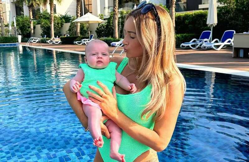 She posed with her daughter in matching turquoise outfits as she enjoyed some of the warm weather