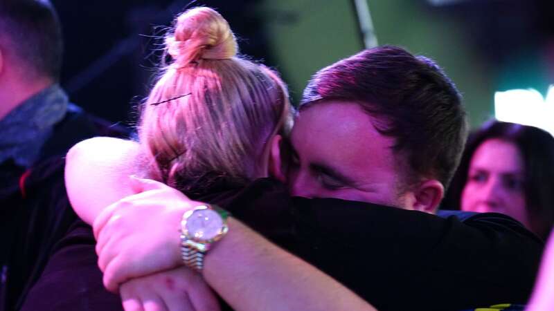 Luke Littler shared an embrace with his girlfriend (Image: PA)