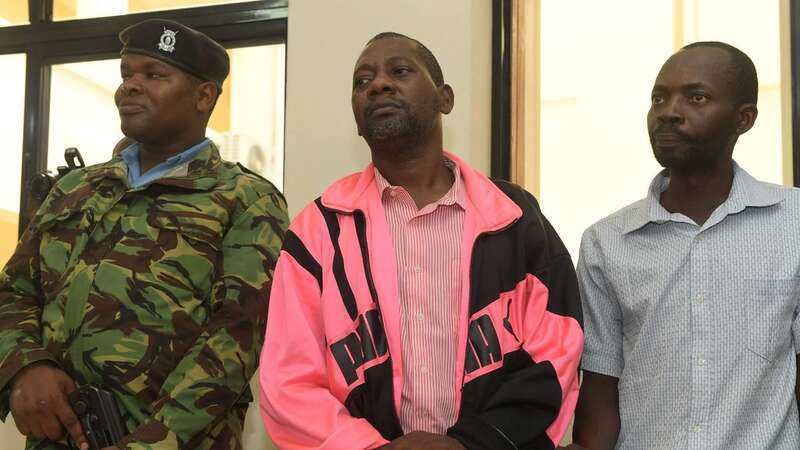 Self-proclaimed pastor Paul Nthenge Mackenzie (centre), who set up the Good News International Church (Image: AFP via Getty Images)