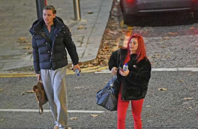 Bobby, 20, could be seen being the perfect gentleman as he helped Dianne with her bags