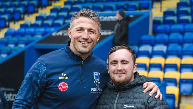 Luke Littler with Warrington Wolves coach Sam Burgess (Image: Joe Richardson / Warrington Wolves)