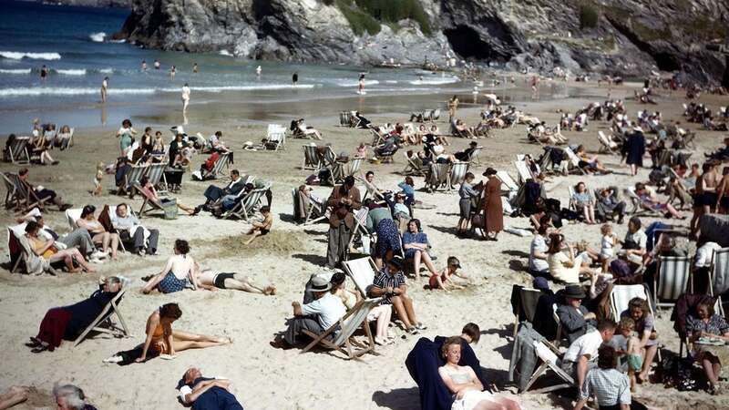 An apparent beach goer among the scores of others seems to be from a different era (Image: Getty Images/Popperfoto Creative)