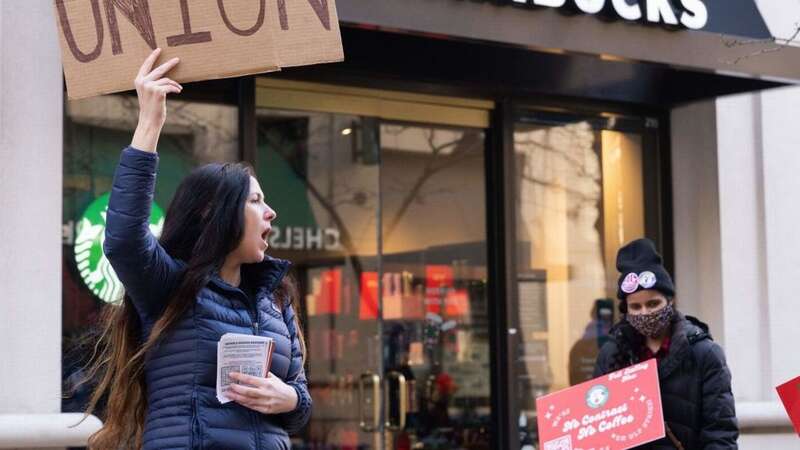 Workers United alleges Starbucks has withheld pay raises and benefits from affiliated workers (Image: AFP via Getty Images)