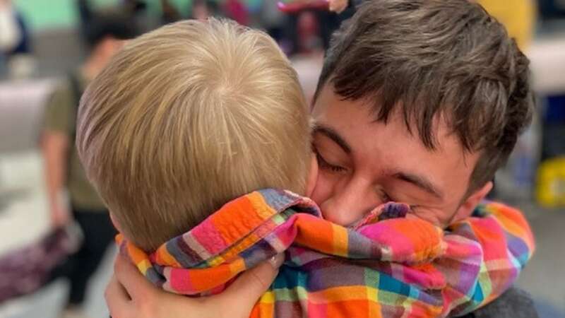 Tom was welcomed home by his son Robbie, 6, and husband Dustin (Image: Instagram)