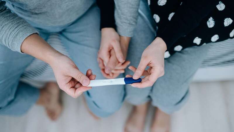 A man is considering postponing his wedding after his fiancé faked a miscarriage (Image: Getty Images)