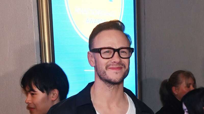 Kevin Clifton oozes confidence as he rocks platform heels at WhatsOnStage Awards (Image: Alan Chapman/Dave Benett/Getty I)