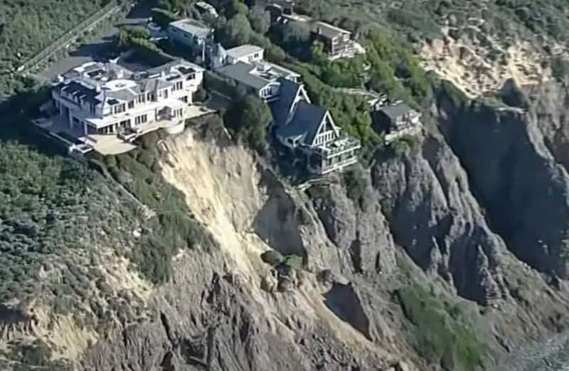 The video above shows the houses teetering dangerously on the cliff-edge